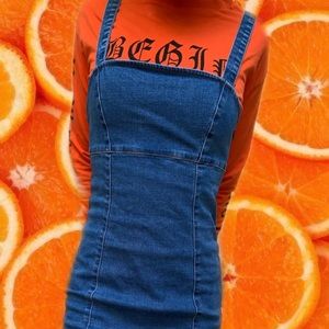 Denim dress with cropped sweatshirt combo.